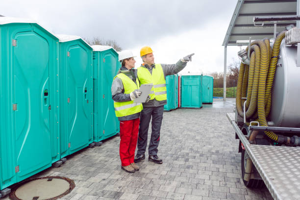workers inspecting mobile toilet before shipment to the customer
